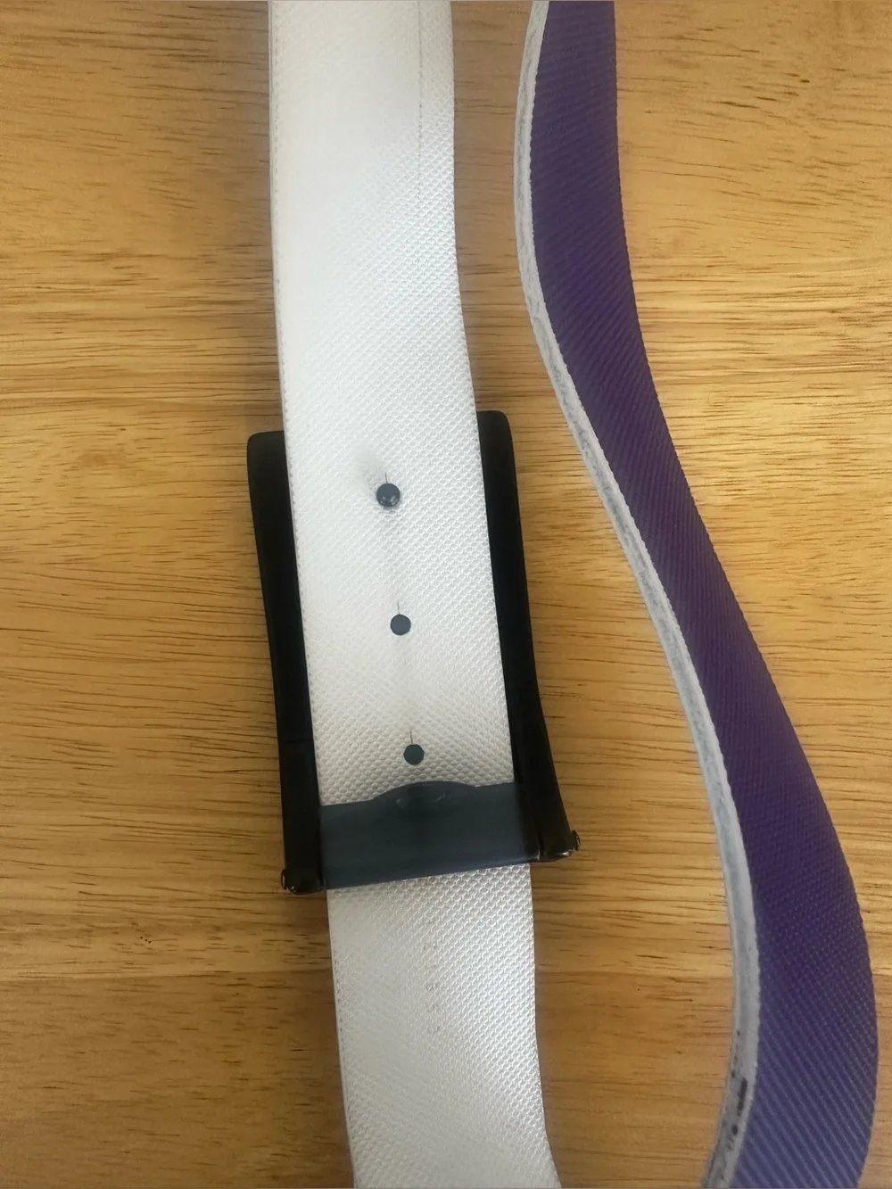 Oakley Belt Buckle with Purple Belt.